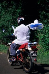 Comoros-Archipelago;-Daily-life;-Fan;-France;-Indian-Ocean;-Kaleidos;-Kaleidos-images;-La-parole-à-limage;-Laurent-Abad;-Mayotte;-Motorbike;-Motorcyclist;-Road;-Stories-Pictures;-Transport